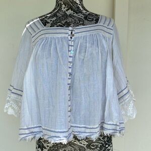 Free People cream crop top with colorful threads. Size medium.